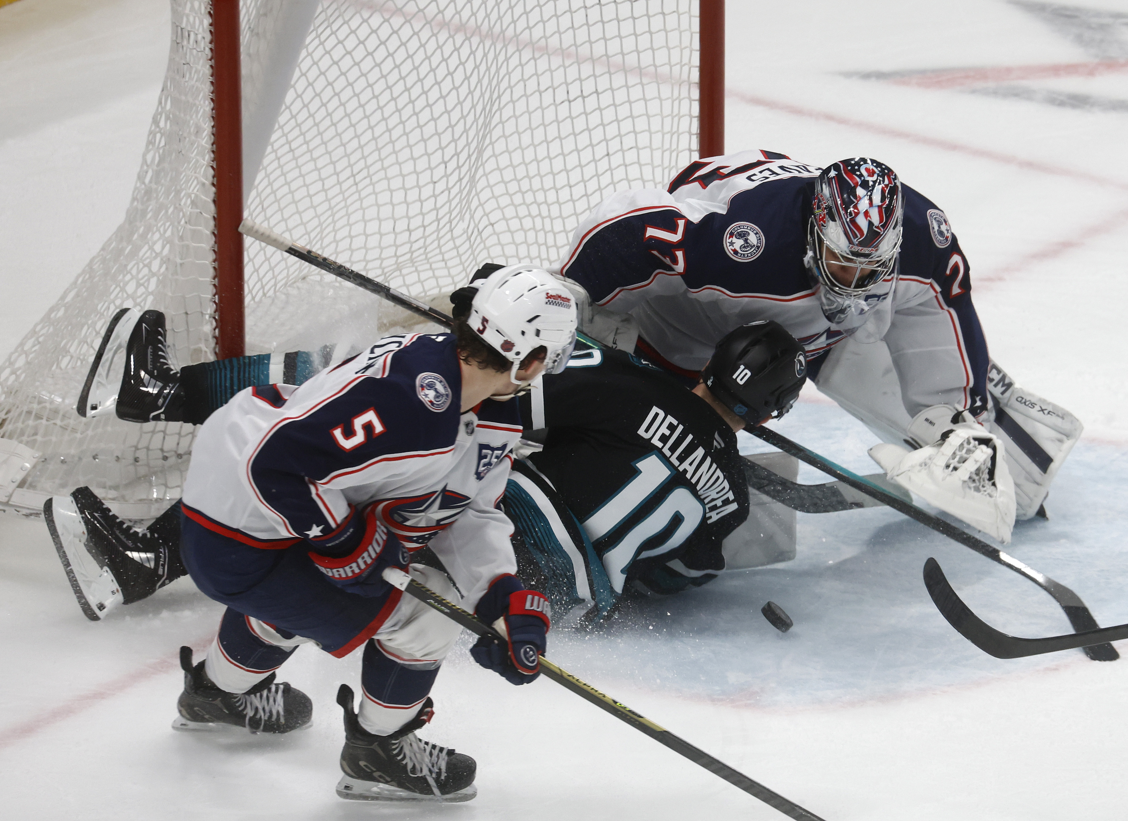 San Jose Sharks’ Ty Dellandrea (10) runs into the goal...