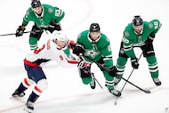 Dallas Stars left wing Jason Robertson (21) challenges Washington Capitals right wing Ryan...