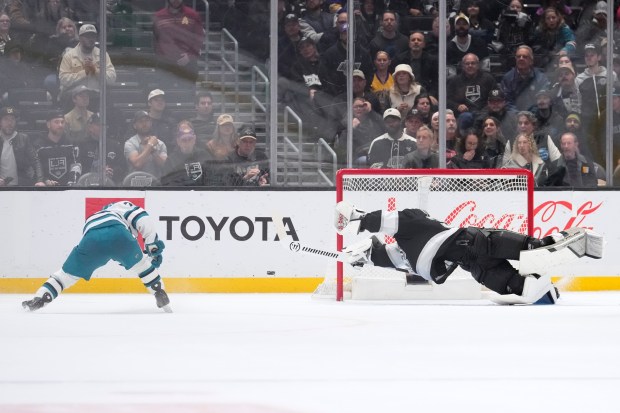 San Jose Sharks left wing William Eklund, left, scores on Los Angeles Kings goaltender Darcy Kuemper during overtime of an NHL hockey game Wednesday, Jan. 7, 2026, in Los Angeles. (AP Photo/Mark J. Terrill)