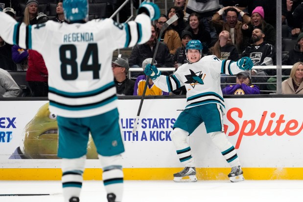 San Jose Sharks center MacKlin Celebrini, right, celebrates his goal with left wing Pavol Regenda during the third period of an NHL hockey game against the Los Angeles Kings, Wednesday, Jan. 7, 2026, in Los Angeles. (AP Photo/Mark J. Terrill)