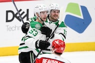 Dallas Stars center Wyatt Johnston (53) celebrates his goal with center Sam Steel (18)...