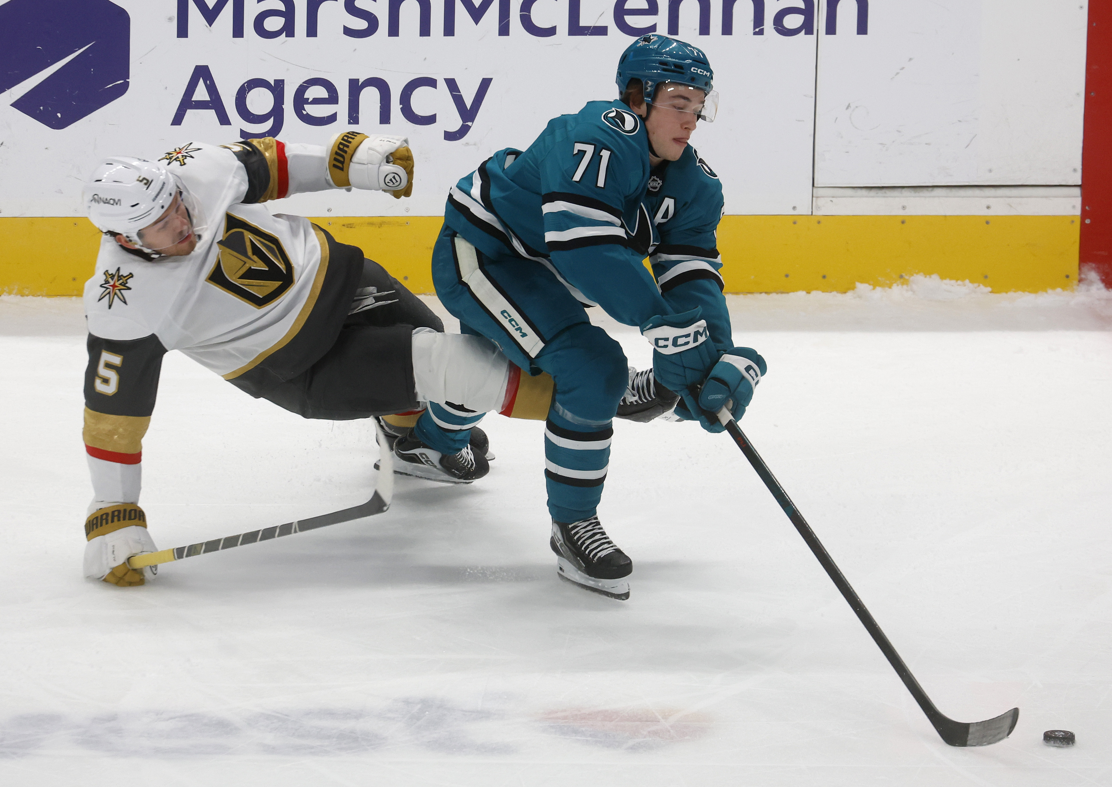 San Jose Sharks' Macklin Celebrini (71) controls the puck against...