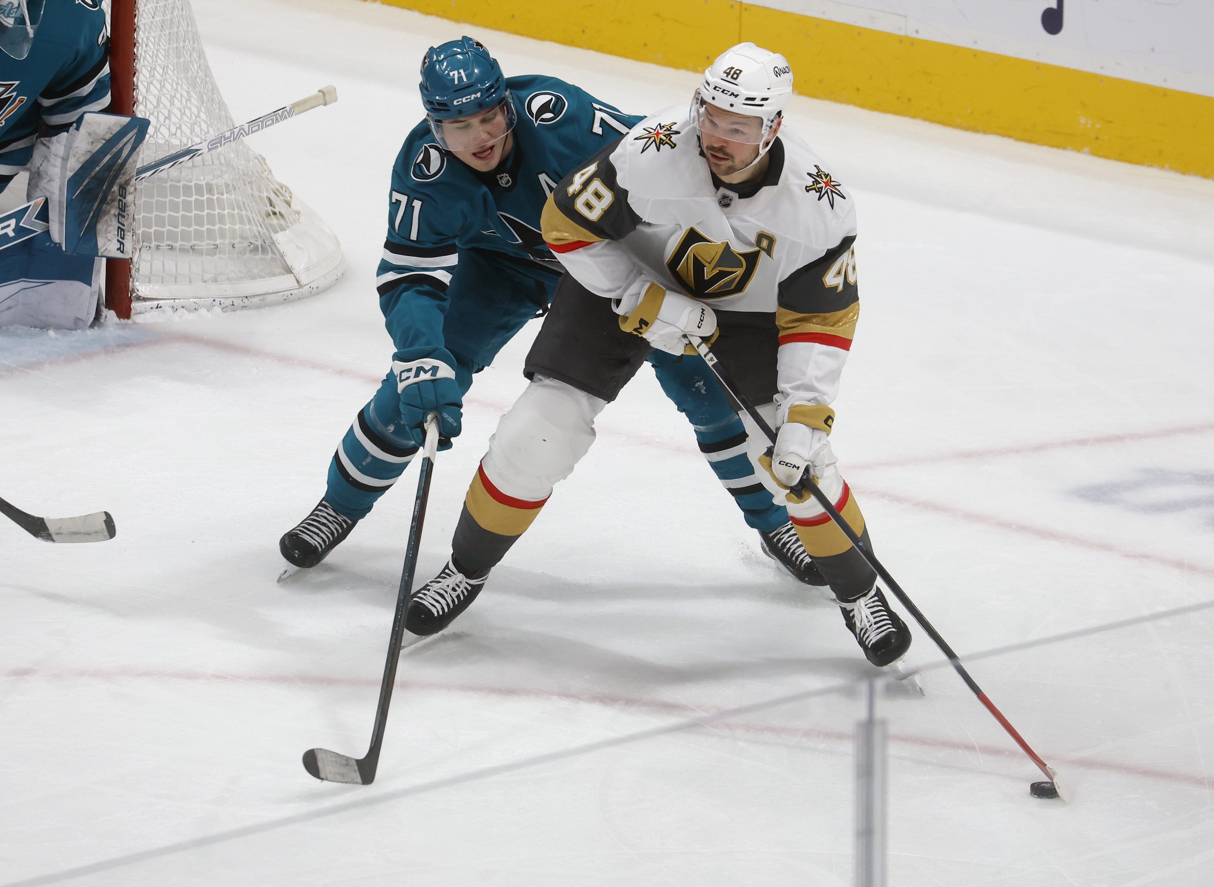 San Jose Sharks' Macklin Celebrini (71) defends against Vegas Golden...