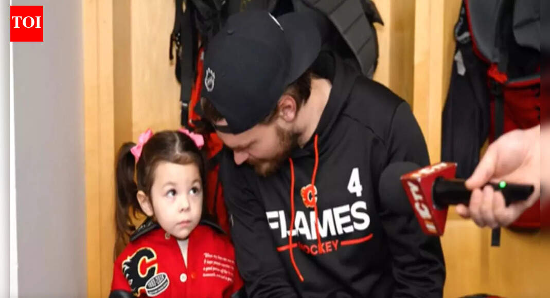 Johnny Gaudreau’s daughter Noa steals a cute moment with Rasmus Andersson at Calgary Flames media availability | NHL News