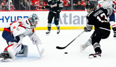Washington Capitals goaltender Logan Thompson (48) defends against New Jersey Devils center Nico Hischier (13) during the second period of an NHL hockey game Saturday, Dec. 27, 2025, in Newark, N.J. (AP Photo/Noah K. Murray)