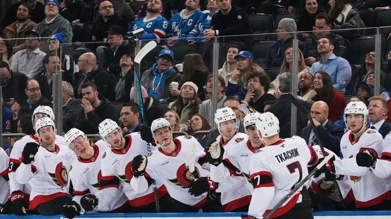 Ottawa Senators' Brady Tkachuk (7) celebrates with teammates after scoring...