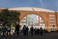 Fans depart the American Airlines Center after an NHL hockey game between the Dallas Stars...