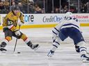 Mitch Marner of the Vegas Golden Knights skates with the puck against Auston Matthews of the Toronto Maple Leafs in the second period of their game at T-Mobile Arena on Jan. 15, 2026 in Las Vegas, Nevada. 