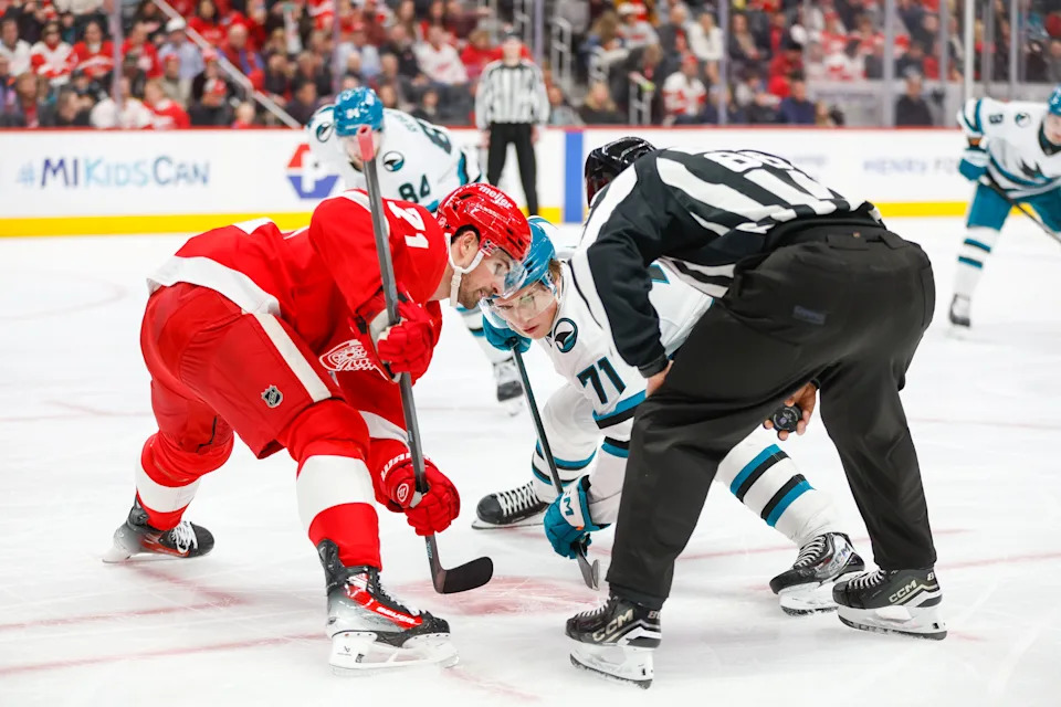 San Jose Sharks center Macklin Celebrini (71) faces off against Detroit Red Wings center Dylan Larkin (71) during the first period at Little Caesars Arena in Detroit on Friday, Jan. 16, 2026.