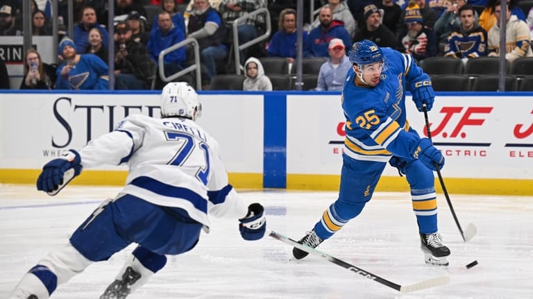 Tampa Bay Lightning's Anthony Cirelli, left, defends as St. Louis...