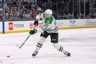 Dallas Stars defenseman Thomas Harley shoots the puck against the Utah Mammoth during the...