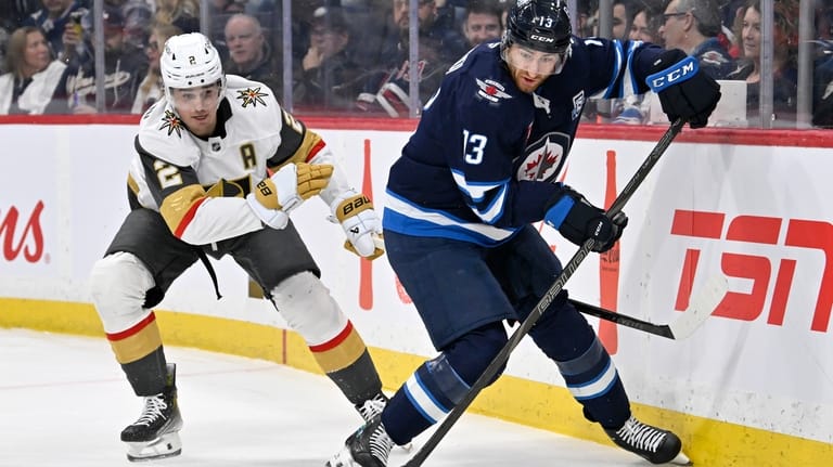 Winnipeg Jets' Gabriel Vilardi (13) looks to make a pass...