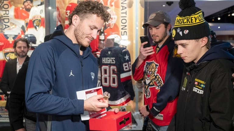 Florida Panthers' Matthew Tkachuk shows fans the team's 2025 Stanley...