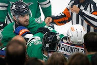 Dallas Stars defenseman Lian Bichsel (6) fights with Edmonton Oilers right wing Vasily...