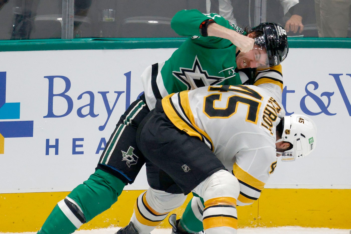 Dallas Stars right wing Nathan Bastian (11) fights with Boston Bruins defenseman Jonathan...