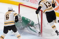 Boston Bruins center Charlie Coyle (13) scores against Dallas Stars goaltender Jake...
