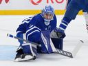 Artur Akhtyamov of the Toronto Maple Leafs makes a pad save against the Edmonton Oilers during a game in December 2025. 