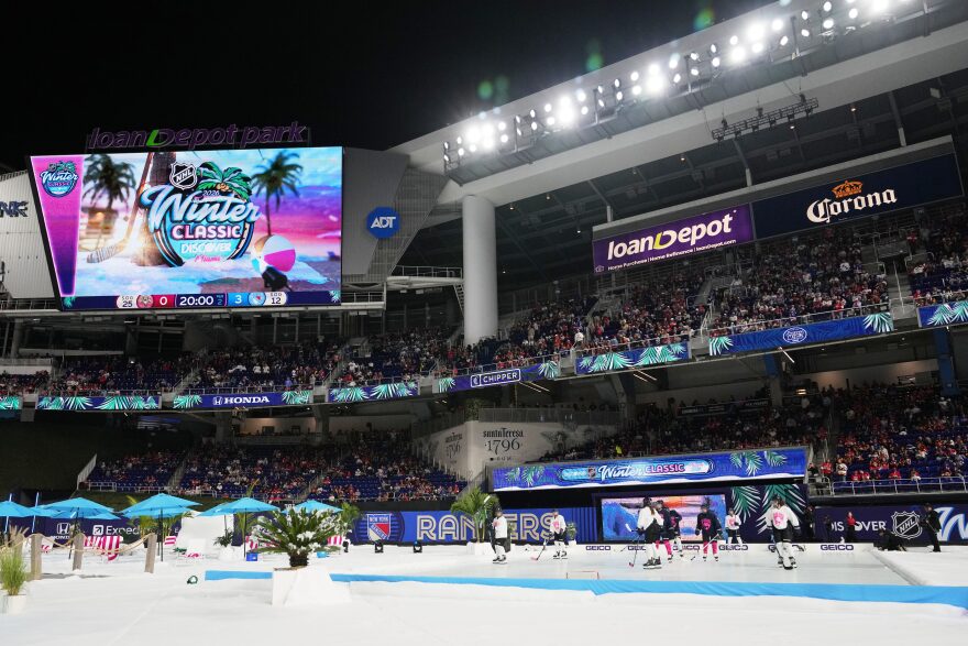 People skate on a small rink during the NHL Winter Classic outdoor hockey game between the Florida Panthers and the New York Rangers at loanDepot Park.