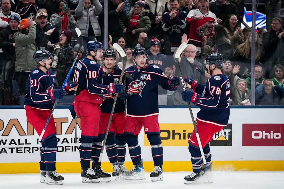 Blue Jackets defenseman Zach Werenski (second from right) has 19 goals this season.