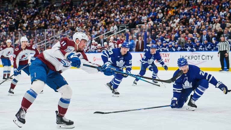 Colorado Avalanche's Brock Nelson (11) scores against the Toronto Maple...