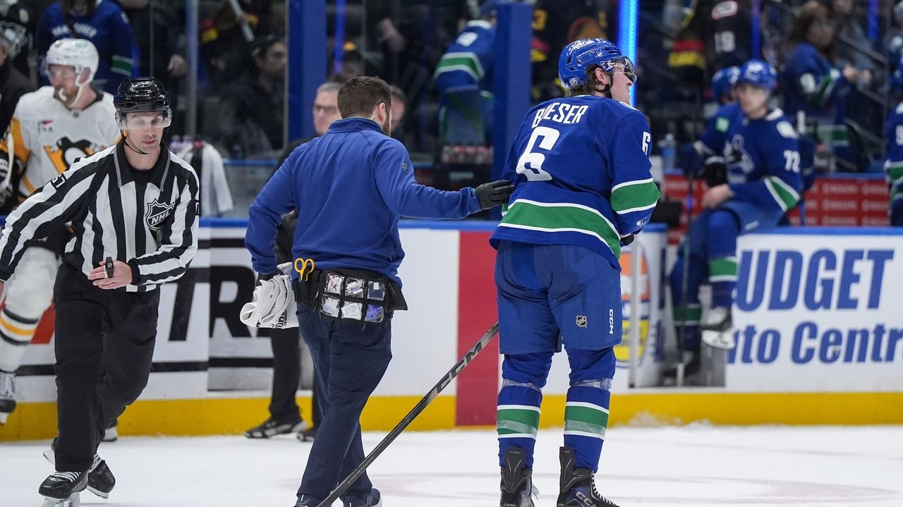 Canucks place winger Boeser and defenseman Buium on injured reserve