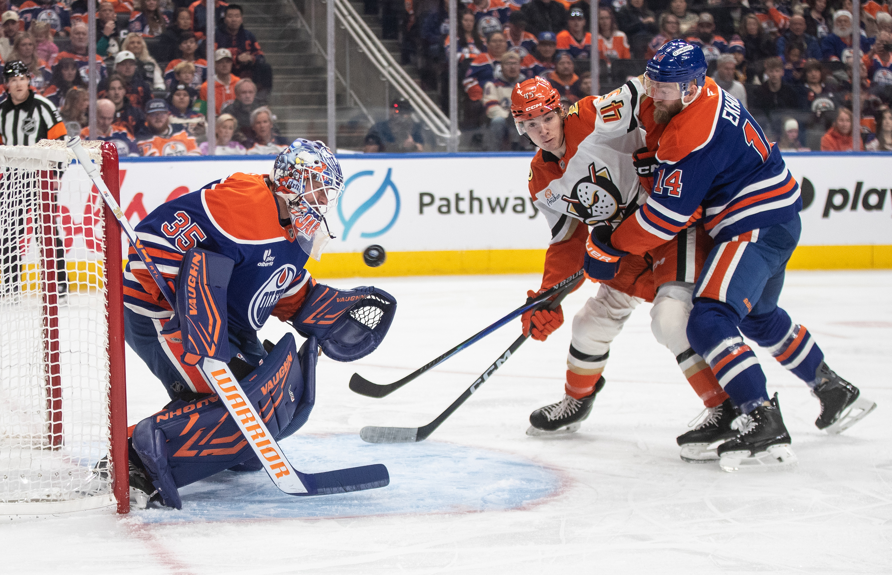 The Ducks’ Beckett Sennecke (45) and the Edmonton Oilers’ Mattias...