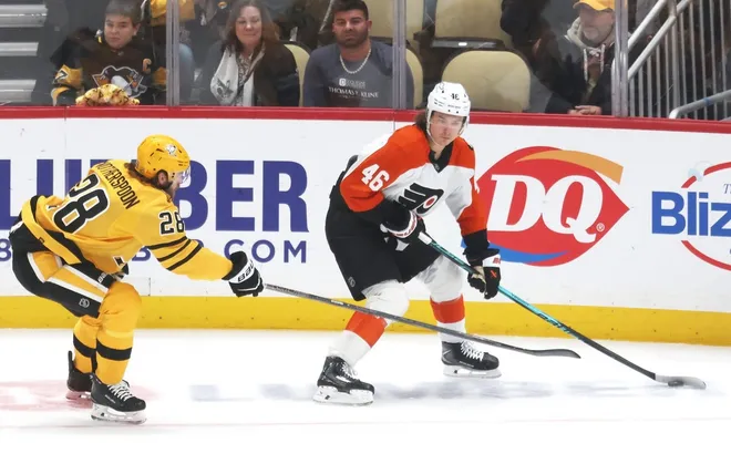 Jan 15, 2026; Pittsburgh, Pennsylvania, USA; Philadelphia Flyers center Trevor Zegras (46) skates with the puck against Pittsburgh Penguins defenseman Parker Wotherspoon (28) during the second period at PPG Paints Arena.