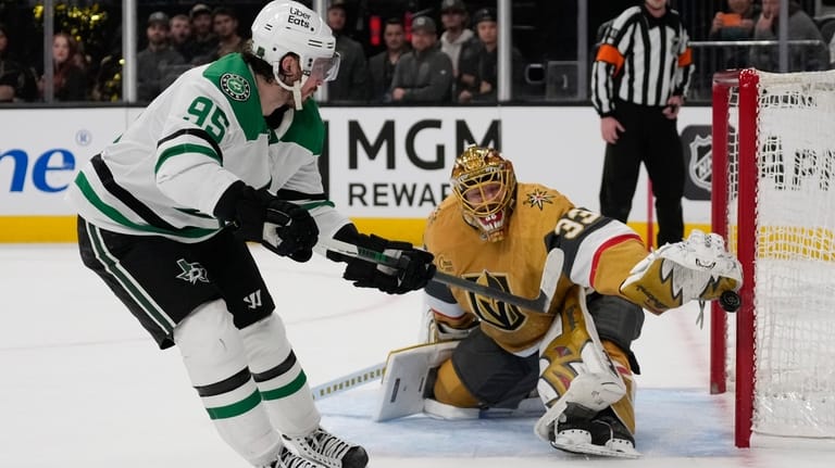 Vegas Golden Knights goaltender Adin Hill (33) stops a shot...