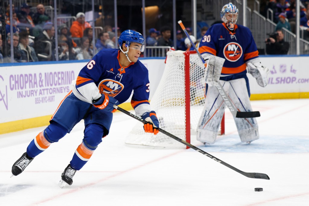 New York Islanders defenseman Isaiah George (36) skates up ice during the second period against the St. Louis Blues at UBS Arena, Saturday, Nov. 23, 2024, in Elmont, NY.