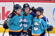 WASHINGTON DC, JANUARY 18: New York Sirens players Taylor Girard (17), Kristyna Kaltounkova (98) and Sarah Fillier (10) celebrate an early goal during the first period of the PWHL Takeover Tour game between the Montreal Victoire and New York Sirens on January 18, 2026 at Capital One Arena in Washington, DC. (Photo: Robert Raymer)