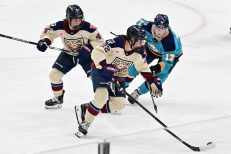 WASHINGTON DC, JANUARY 18: Defender Jessica DiGirolamo (22) of the Montreal Victoire drives to the net around Forward Taylor Girard (17) of the New York Sirens during the first period of the PWHL Takeover Tour game between the Montreal Victoire and New York Sirens on January 18, 2026 at Capital One Arena in Washington, DC. (Photo: Robert Raymer)