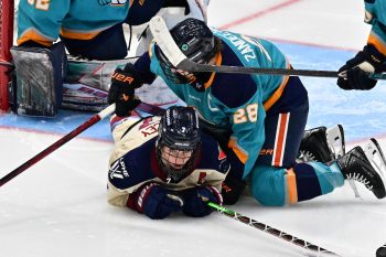 WASHINGTON DC, JANUARY 18: Forward Laura Stacey (7) of the Montreal Victoire is taken down in front of the net by Defender Micah Zandee-Hart (28) of the New York Sirens during the second period of the PWHL Takeover Tour game between the Montreal Victoire and New York Sirens on January 18, 2026 at Capital One Arena in Washington, DC. (Photo: Robert Raymer)