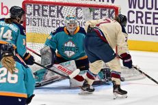 WASHINGTON DC, JANUARY 18: Goaltender Kayle Osborne (82) of the New York Sirens makes a save in tight against Forward Laura Stacey (7) of the Montreal Victoire during the third period of the PWHL Takeover Tour game between the Montreal Victoire and New York Sirens on January 18, 2026 at Capital One Arena in Washington, DC. (Photo: Robert Raymer)