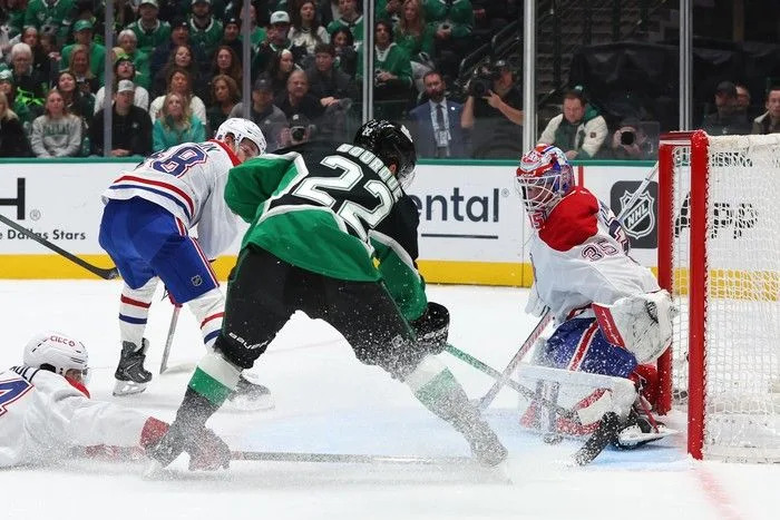  Samuel Montembeault of the Montreal Canadiens blocks a shot from Mavrik Bourque of the Dallas Stars during the first period at American Airlines Center on Sunday, January 4, 2026 in Dallas, Texas.