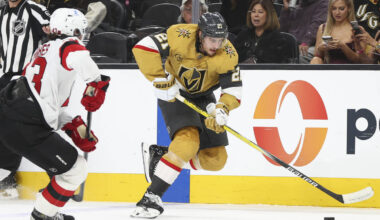 Golden Knights center Brett Howden (21) skates with the puck under pressure from New Jersey Dev ...
