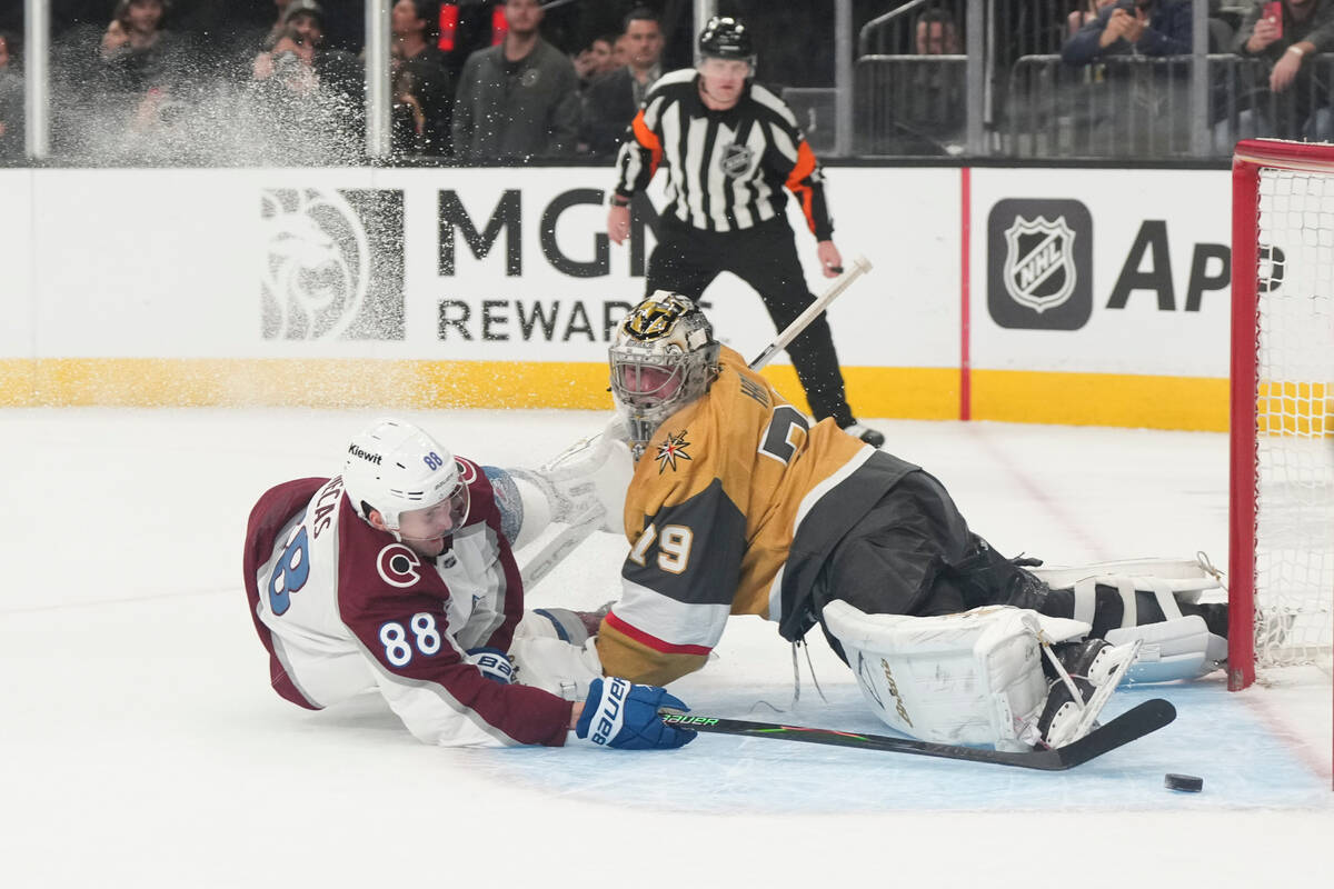 Colorado Avalanche center Martin Necas (88) scores on Vegas Golden Knights goaltender Carter Ha ...
