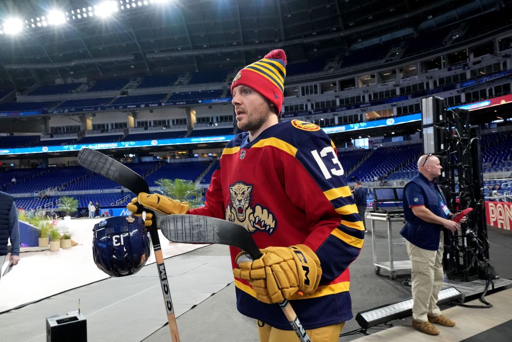 Florida Panthers player Sam Reinhart holding his stick and helmet during practice for the NHL Winter Classic.
