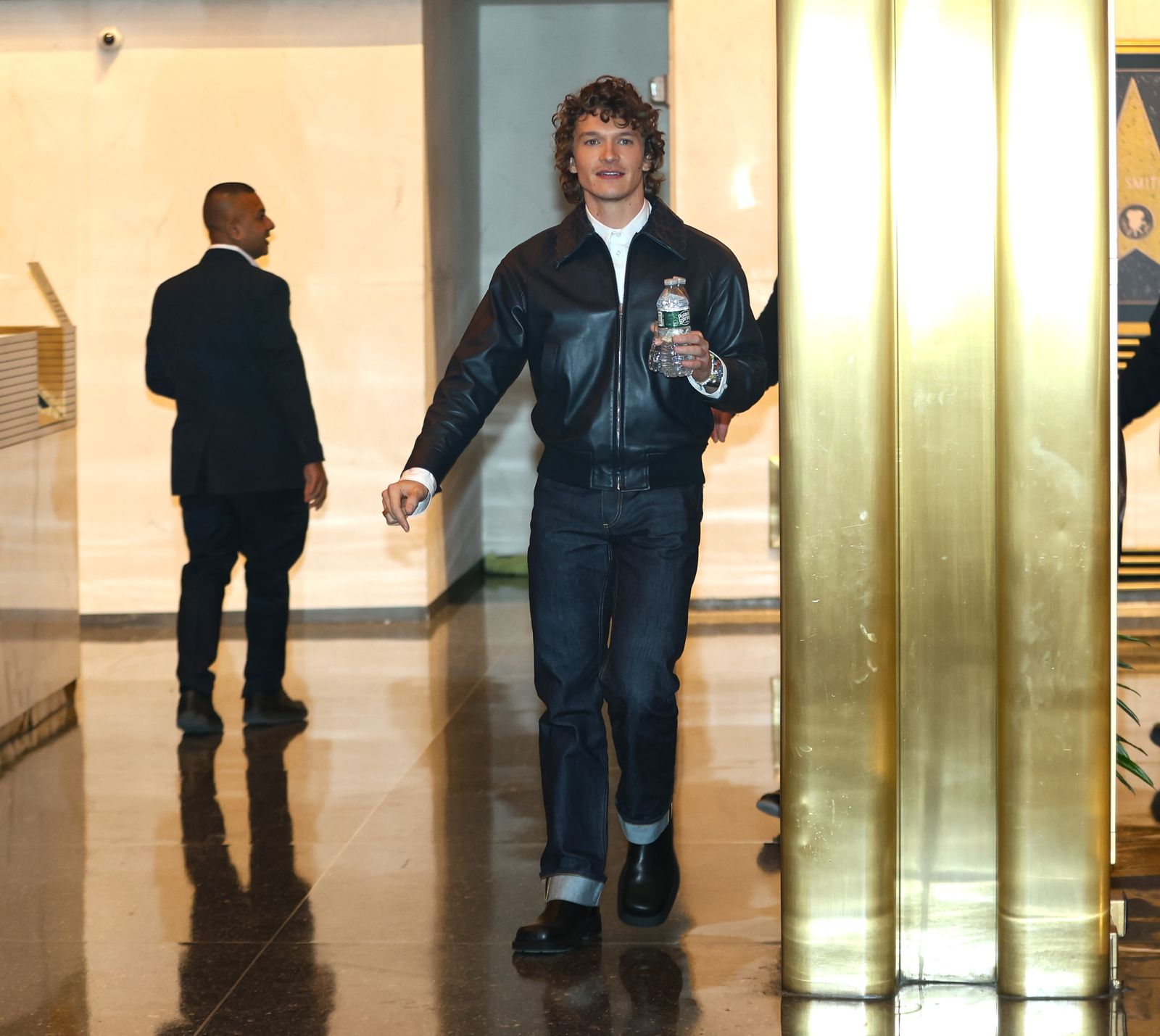 Image may contain Sylvain Tesson Clothing Coat Jacket Pants Adult Person Footwear Shoe Standing and Jeans