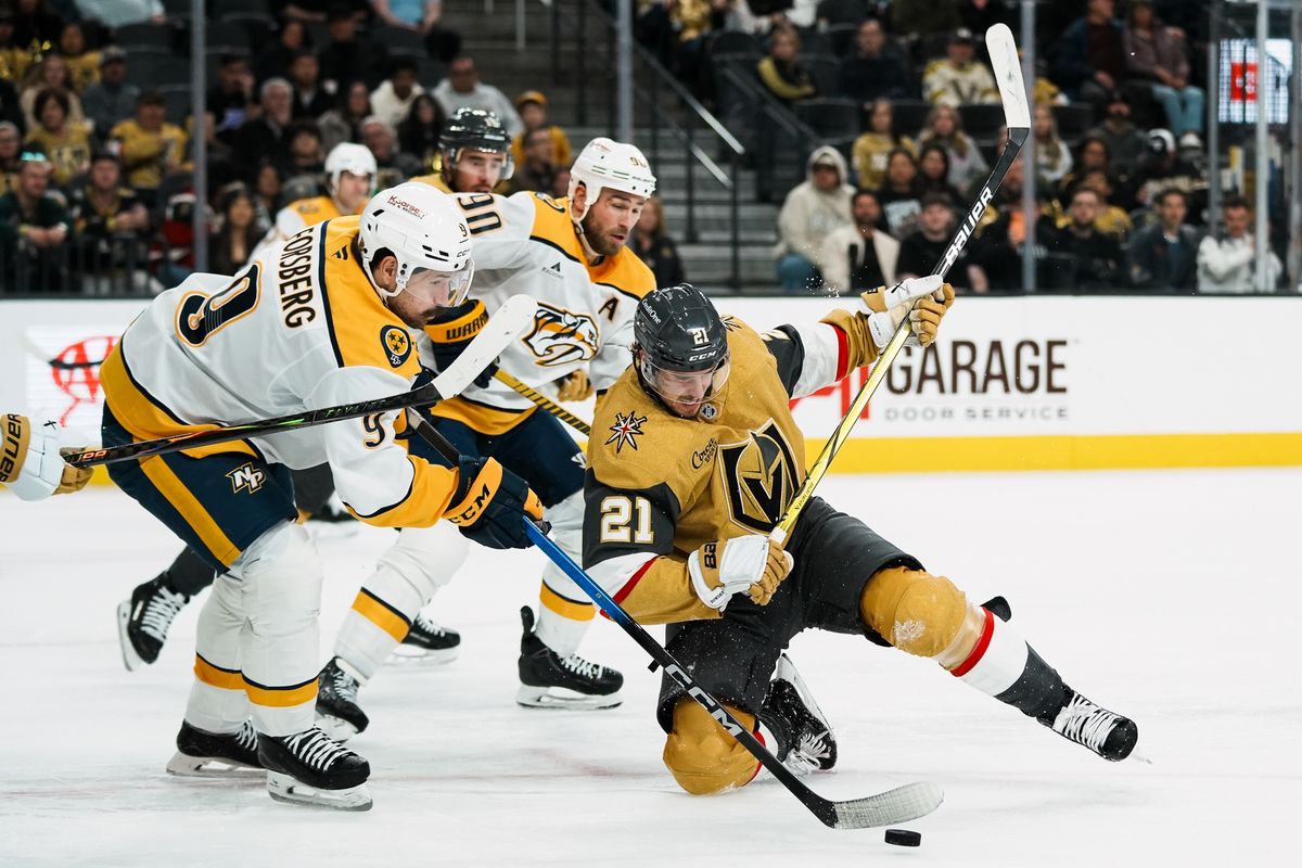Vegas Golden Knights center Brett Howden (21) and Predators left wing Filip Forsberg (9) and center Ryan O’Reilly (90) collide going after the puck during third period of NHL game against Nashville Predators on Wed. Dec. 31, 2025 at T-Mobile Arena in Las Vegas. Vegas Golden Knights center Brett Howden (21) and Predators left wing Filip Forsberg (9) and center Ryan O’Reilly (90) collide going after the puck during third period of NHL game against Nashville Predators on Wed. Dec. 31, 2025 at T-Mobile Arena in Las Vegas.