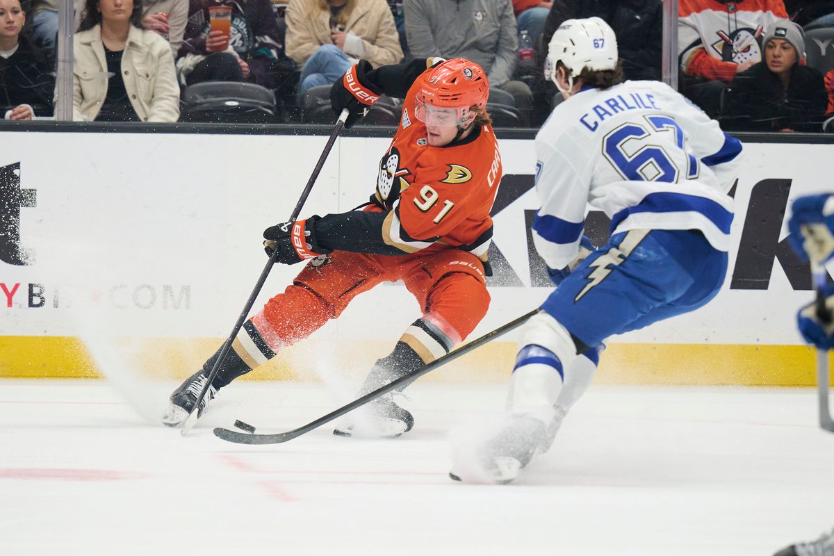 Anaheim Ducks center Leo Carlsson (91) gains control of the puck against the Lightning at the Honda Center on December 31,2025 in Anaheim, California. Anaheim Ducks center Leo Carlsson (91) gains control of the puck against the Lightning at the Honda Center on December 31,2025 in Anaheim, California.