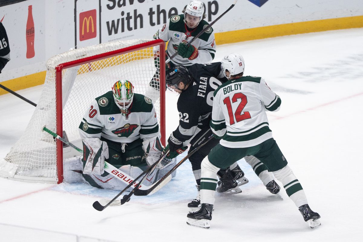 Los Angeles Kings Defender Brandt Clarke (22) takes a shot on goal between the defenders in a NHL game against the Minnesota Wild at Crypto.com Arena on January 3rd, 2026 in Los Angeles  California.