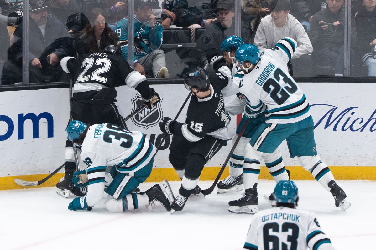 The Los Angeles Kings players try to steal the puck against the wall in a NHL game against the San Jose Sharks at the Crypto Arena on January 7th, 2026 in Los Angeles California.