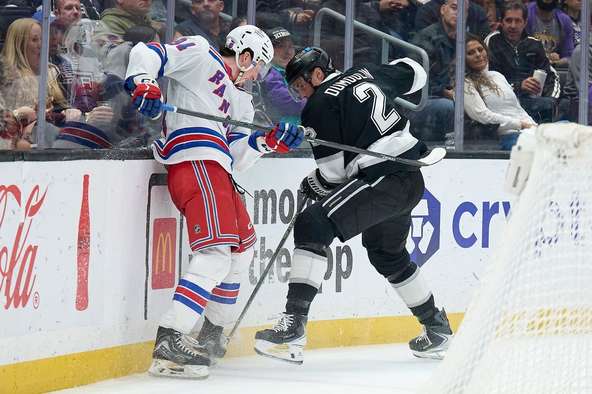 The Los Angeles Kings defender Brian Dumoulin (2) fights for the puck against the New York Rangers at the Crypto Arena on January 20th, 2026 in Los Angeles California. The Los Angeles Kings defender Brian Dumoulin (2) fights for the puck against the New York Rangers at the Crypto Arena on January 20th, 2026 in Los Angeles California.