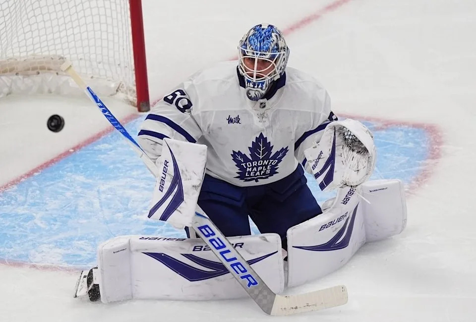 Toronto Maple Leafs goaltender Joseph Woll deflects a shot in the first period of an NHL hockey game against the Colorado Avalanche, Monday, Jan. 12, 2026, in Denver.