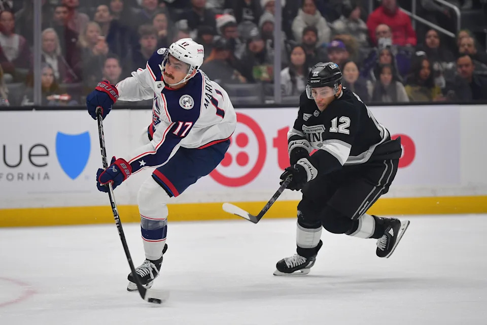 Dec 22, 2025; Los Angeles, California, USA; Columbus Blue Jackets left wing Mason Marchment (17) scores a goal ahead of Los Angeles Kings left wing Trevor Moore (12) during the first period at Crypto.com Arena. Mandatory Credit: Gary A. Vasquez-Imagn Images