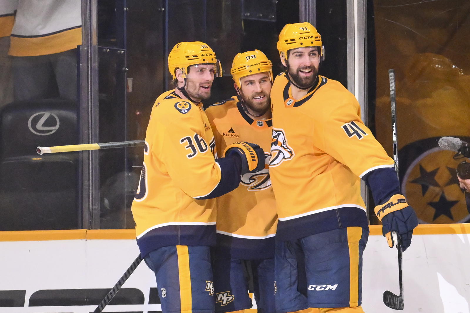 Jan 8, 2026; Nashville, Tennessee, USA; Nashville Predators center Ryan O'Reilly (90) celebrates with his teammates after scoring a goal against the New York Islanders during the second period at Bridgestone Arena. Mandatory Credit: Steve Roberts-Imagn Images