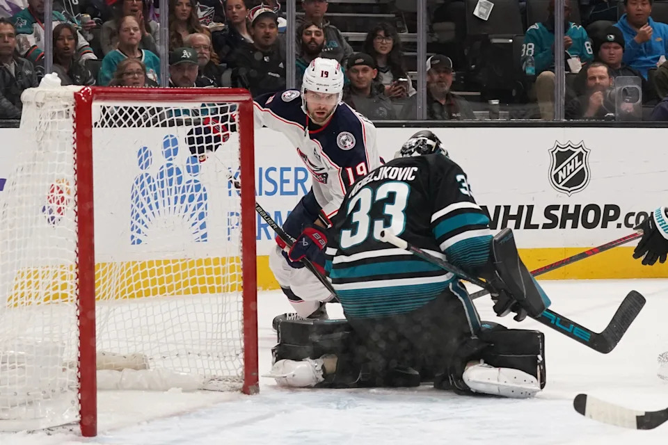 Jan 6, 2026; San Jose, California, USA; Columbus Blue Jackets center Adam Fantilli (19) takes a shot on goal against San Jose Sharks goaltender Alex Nedeljkovic (33) in the first period at SAP Center at San Jose. Mandatory Credit: David Gonzales-Imagn Images