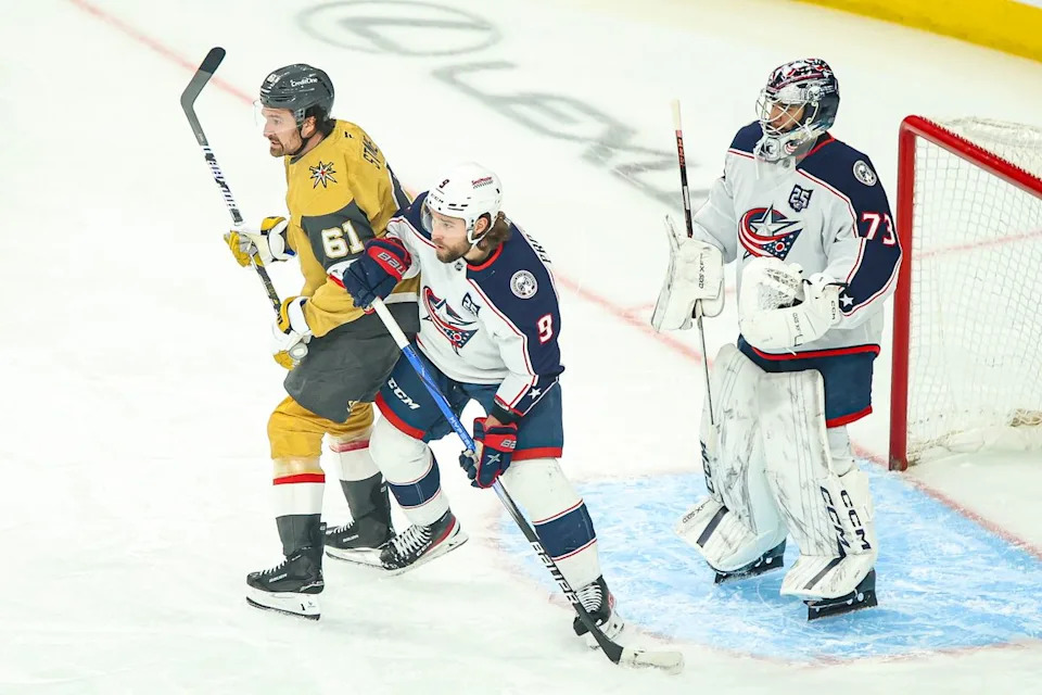 Vegas Golden Knights F Mark Stone (61) and Columbus Blue Jackets D Ivan Provorov (9) battle for position during an NHL game on Thursday January 8, 2026, in Las Vegas, Nevada.