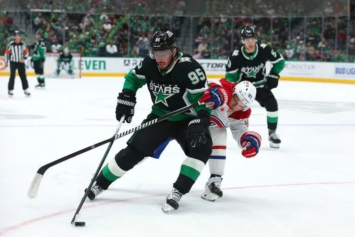  Matt Duchene of the Dallas Stars skates with the puck as Ivan Demidov of the Montreal Canadiens defends during the first period at American Airlines Center on Sunday, January 4, 2026 in Dallas, Texas.