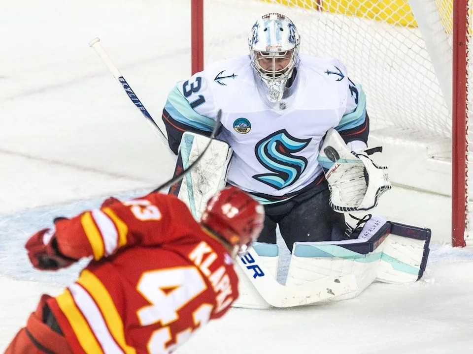  Calgary Flames winger Adam Klapka takes a shot on Seattle Kraken gaoltender Philipp Grubauer at the Scotiabank Saddledome on Monday, Jan. 5.